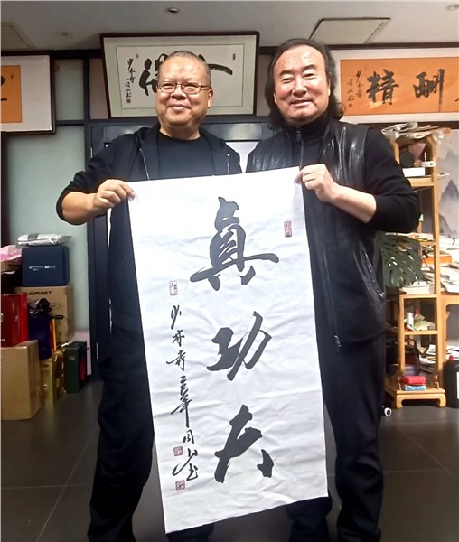 “精忠报国武术文化行”走进少林小龙武校 共赏功夫盛宴，开展书法交流